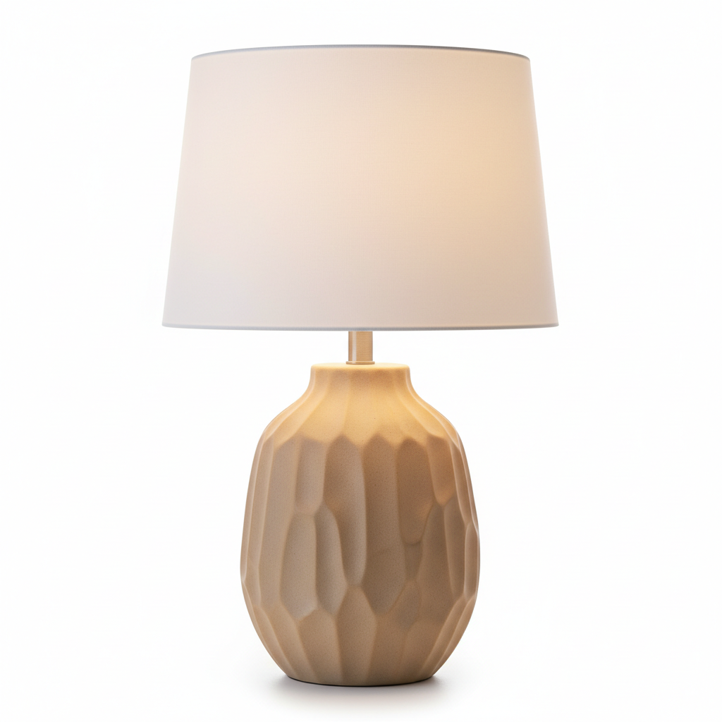 Close-up of matte beige ceramic table lamp base on white background